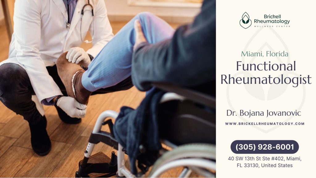 Functional Rheumatology 3 A rheumatologist in Miami examines a patient seated in a wheelchair during a medical consultation.