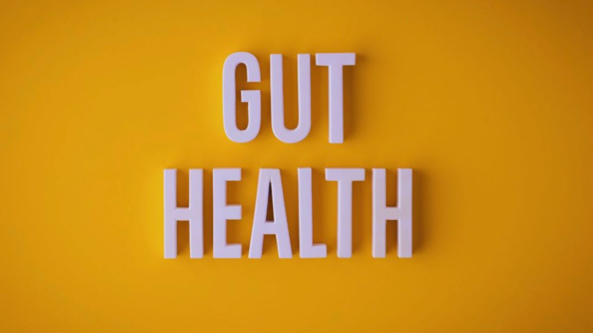 The words 'Gut Health' in large, white, three-dimensional letters against a bright yellow background, emphasizing the importance of digestive wellness.